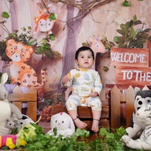 Cute baby in a jungle themed photography setup