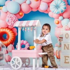 Baby with a colorful candy cart photography setup