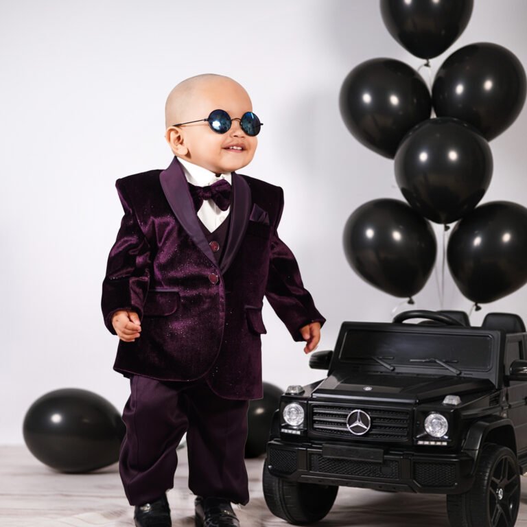 Baby in a stylish G Wagon themed photography setup